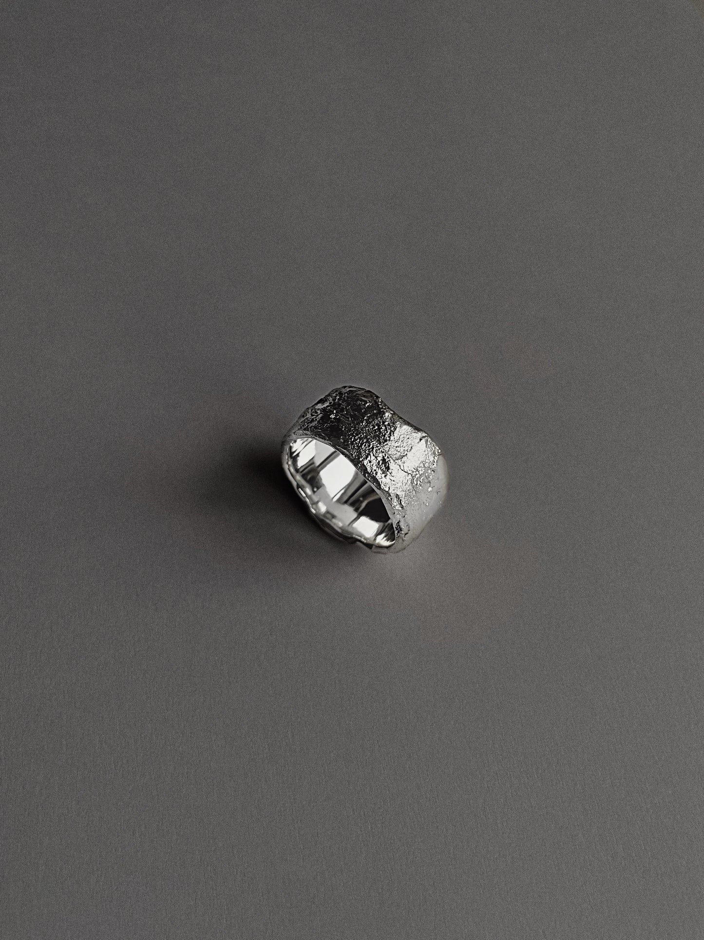 a wide and heavy textured ring
