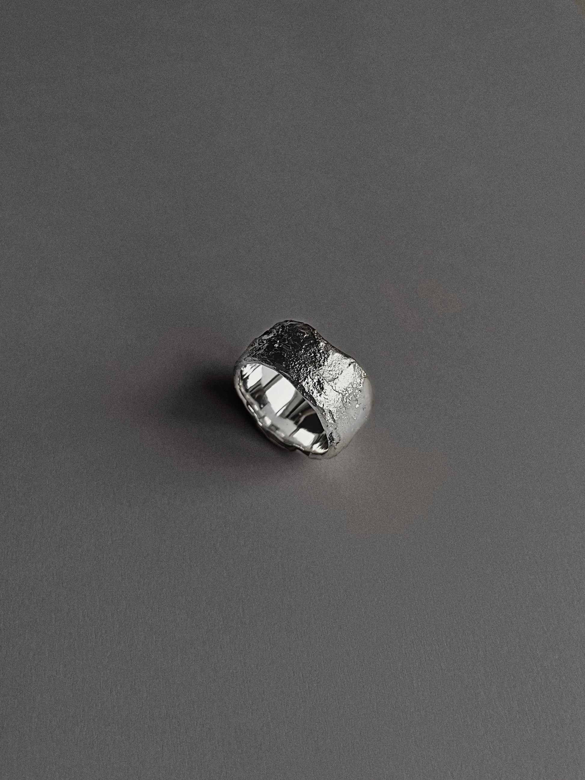 a wide and heavy textured ring